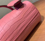 Hermes Kelly Idole (Kelly Doll) in Pink Sakura  Nilo crocodile with Palladium hardware. Hermes Kelly Idole (Kelly Doll) in Pink Sakura  Nilo crocodile with Palladium hardware.