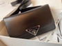 Prada Emblème brushed-leather bag Black