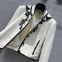 Christian Dior EMBROIDERED CROPPED JACKET White Wool and Silk with Black Ornamental Motif 