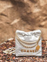  CHANEL 22 MINI HANDBAG GOLD LOGO SS2023 WHITE