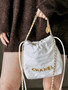  CHANEL 22 MINI HANDBAG GOLD LOGO SS2023 WHITE