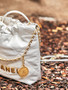  CHANEL 22 MINI HANDBAG GOLD LOGO SS2023 WHITE
