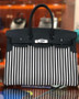 HERMES A LIMITED EDITION BLACK SWIFT LEATHER & TOILE RIGA BIRKIN 35 WITH PALLADIUM HARWARE