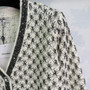 Chanel 26 Spring/Summer Knit Cardigan – Black and White Geometric Jacquard, V-Neck, Wool Blend