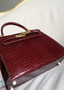 Hermès Kelly 28 Sellier Shiny Porosus Crocodile (Bordeaux, GHW)