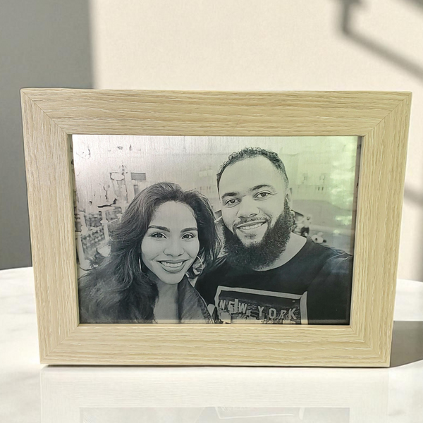 photograph reproduced in silver aluminum
