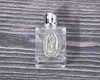 2.5" x 1 3/8" Rectangle Glass Silver Accent Guadalupe Holy Water Bottle - Pack of 12
