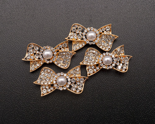 1 3/8" x 3/4" Old Gold Bow Rhinestone Flat Back Metal Charm - Pack of 12