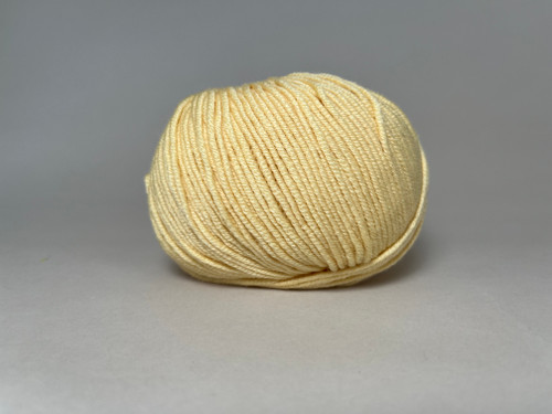 A ball of Sirdar Cashmere Merino Silk DK in color Morning Yellow A ball of Sirdar Cashmere Merino Silk DK in color Morning Yellow