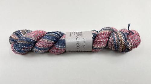 A skein of Primrose Homestead Sport in colorway Eternal A skein of Primrose Homestead Sport in colorway Eternal