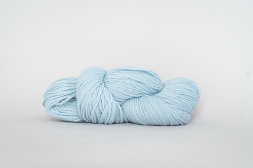 A skein of Universal Deluxe Worsted yarn, Baby Blue color