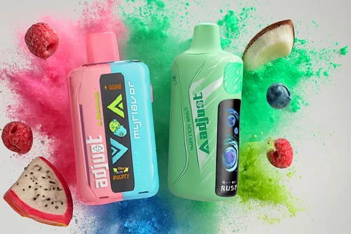 The photo shows two colorful vape devices surrounded by vibrant fruits and powder splashes. On the left is a pink and blue device labeled “VOZOL myflavor” with the flavor “Mixed Fruit BLOODY,” while the right device is mint green, marked “Adijust” with the flavor “WINTER MINT RUSH.” Around them are raspberries, blueberries, a slice of dragon fruit, and a piece of coconut, all set against dynamic bursts of pink, green, and blue powder, creating a lively scene that emphasizes fruity and minty flavor profiles.