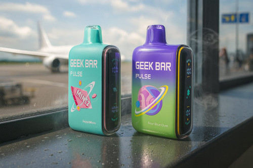 Two disposable Geek Bar Pulse vapes sit on a window ledge at an airport terminal, with a large airplane visible on the tarmac in the background. The devices feature colorful designs and digital screens, positioned under bright daylight near a glass pane with water droplets.