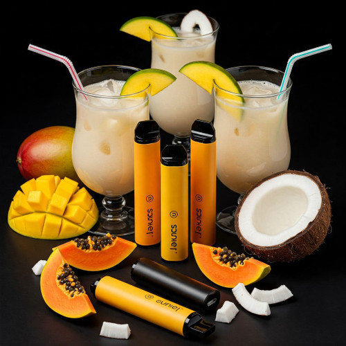 The image shows a collection of tropical fruits and beverages along with several vaping devices. There are three glasses filled with a creamy, iced beverage, each garnished with a slice of mango and a straw. Surrounding the glasses are various fruits including a whole mango, a sliced mango, a halved coconut, coconut pieces, and slices of papaya with seeds. In the foreground, there are six vaping devices, five of which are yellow and one is black, all branded with the name "sunle" and a logo. The image is vibrant and colorful, highlighting the tropical theme and the combination of fruity flavors with vaping products.