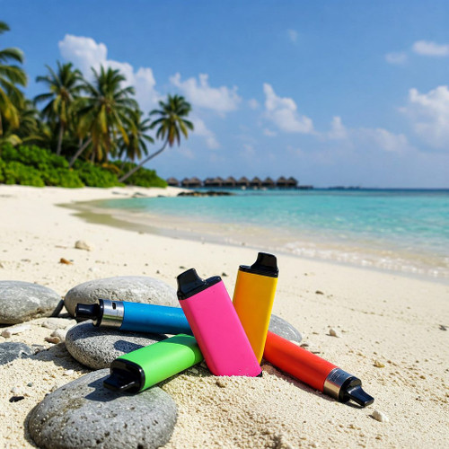 The image shows a beautiful beach scene with clear turquoise water and white sand. In the foreground, there are three disposable vape devices in vibrant colors&mdash;blue, green, and red&mdash;standing upright on the sand. Behind the vapes, there are tall palm trees with lush green leaves gently swaying in the breeze. The sky is clear with a few wispy clouds, creating a perfect tropical paradise. The combination of the colorful vapes and the stunning beach background creates a visually appealing and relaxing atmosphere, capturing the essence of a perfect day in the Maldives.