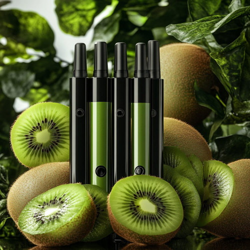 The image shows three black vape devices with green panels standing upright among several whole and sliced kiwifruits. The background consists of green leaves, creating a natural and fresh atmosphere. The juxtaposition of the vapes with the kiwifruits suggests a kiwi-flavored vape product.