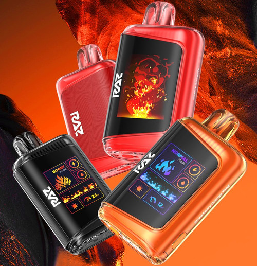 The image shows four electronic devices, likely vape devices, branded with the name "RAZ." Each device has a distinct color and design, set against a fiery, orange background. The devices have screens displaying various graphics and icons. The red device shows an image of flames, the black device displays "BOOST Mode" with fire and power icons, and the orange device shows "NORMAL Mode" with a blue flame and several icons including a sun, a power symbol, and a clock. The text "Cherry Bomb" is visible on the side of the red device, and "Strawberry Orange Tang" is visible on the side of the orange device.