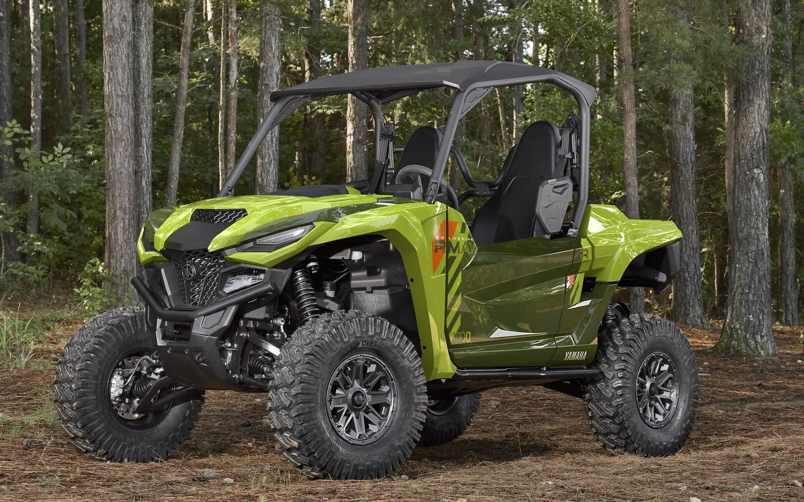 Green 2026 Yamaha Wolverine RMAX2 1000 side-by-side in the woods