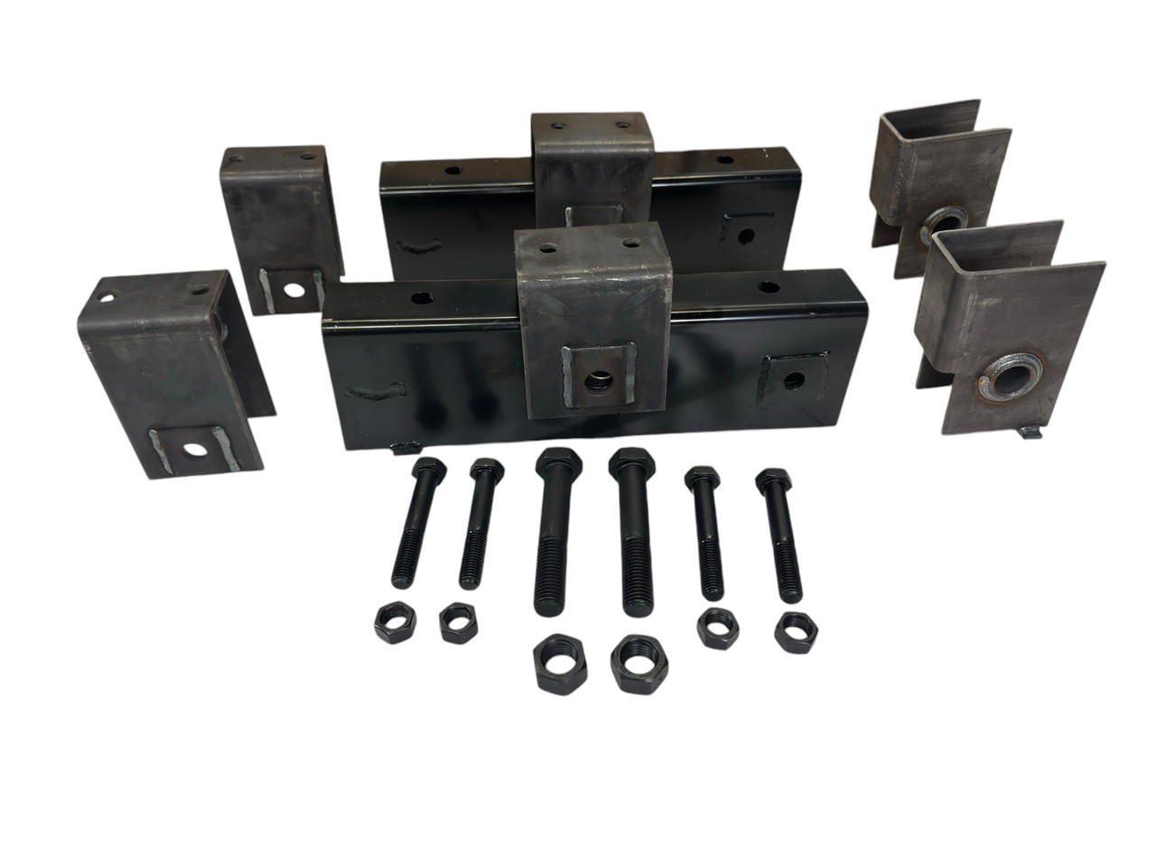 Complete tandem axle hanger kit with 18-3/8" long equalizers. Fits 2-1/2" wide slipper springs on 10K trailer axles. Includes hangers, bolts, and locknuts.