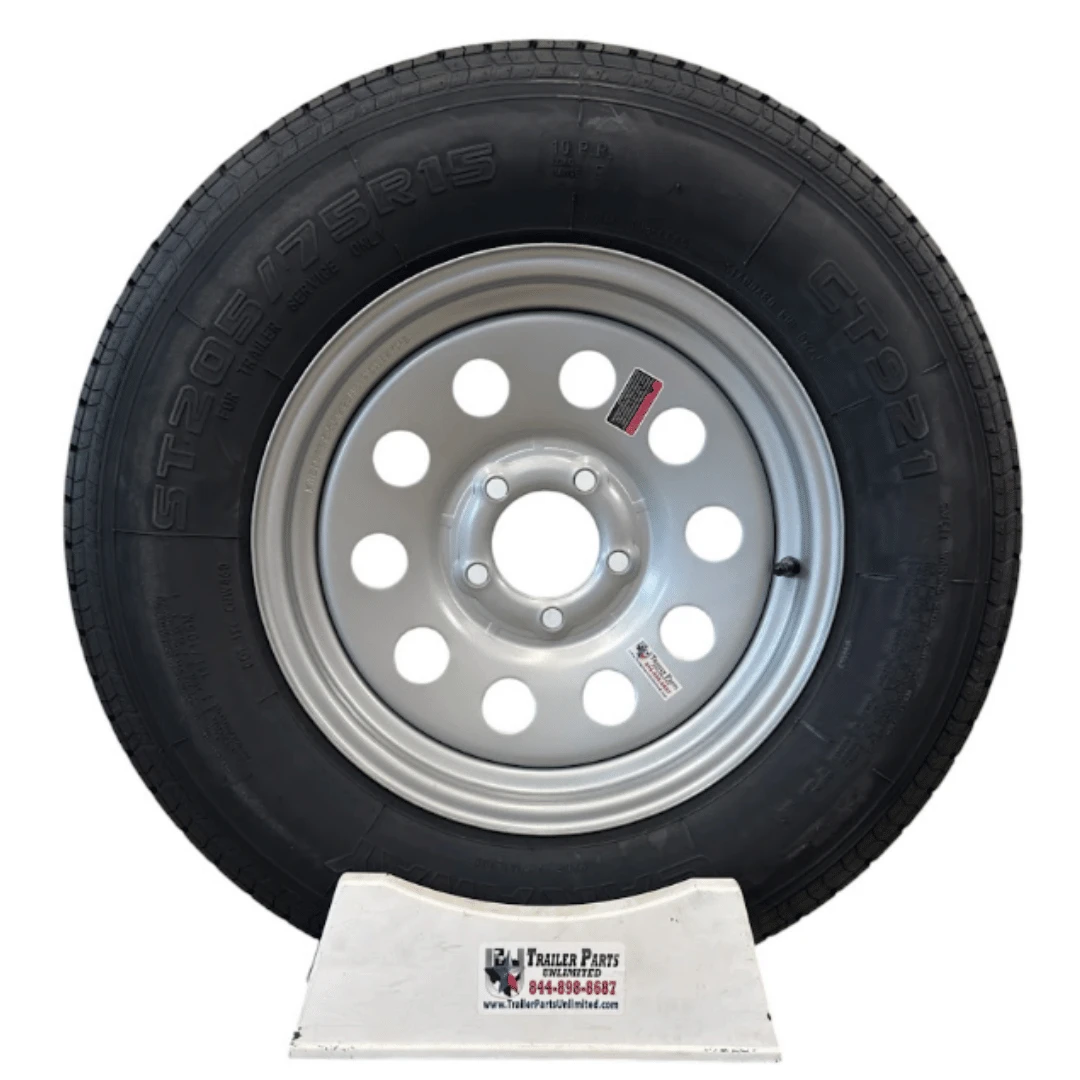 ST205/75R15 10-ply radial trailer tire mounted on 5 lug silver mod wheel 