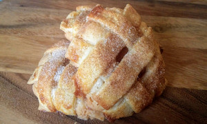 A soft sugar cookie with honeycrisp apples spice with cinnamon and nutmeg. Topped with flakey butter pie crust and cinnamon sugar. A soft sugar cookie with honeycrisp apples spice with cinnamon and nutmeg. Topped with flakey butter pie crust and cinnamon sugar.