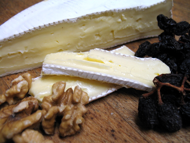 brie with walnuts and raisins on the vine