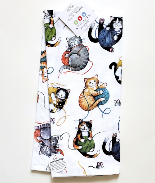 Cat kitchen towel with allover print of playful cats.