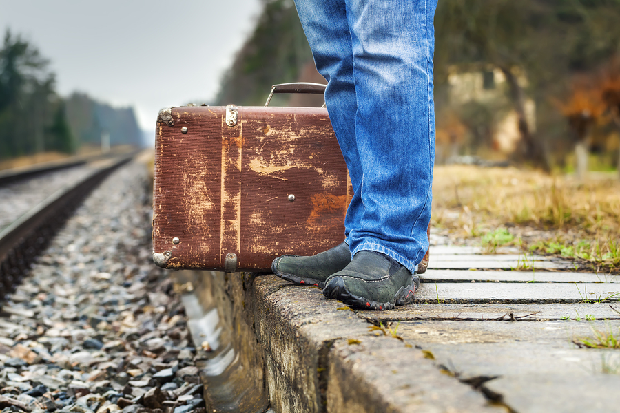 https://cdn11.bigcommerce.com/s-2y453ikcoy/product_images/uploaded_images/bigstock-man-with-a-suitcase-on-the-pla-63804877.jpg