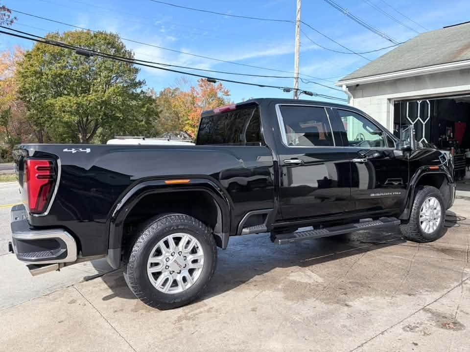 Black GMC Sierra HD pickup with a clean gloss finish