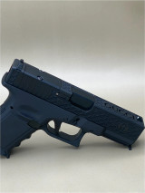 Side‑profile product image of the Kineti-Tech Gucci Slide mounted on a Glock‑style frame, showcasing the CERAKOTE® Armor Black finish, custom slide engraving, and RMR® footprint optic cut. The deep functional slide cuts and stainless steel barrel are visible, emphasizing durability and aesthetic appeal.

Side view of Kineti-Tech Gucci Glock 19 Gen 3 slide with Armor Black finish and RMR optic cut.