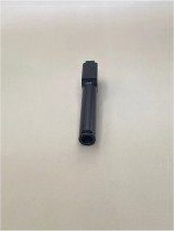 A front-facing view of a black 9mm compensated pistol barrel on a light background. The muzzle opening and extended profile are centered in the frame, highlighting the clean, minimalist design.

Front-facing view of a black 9mm compensated pistol barrel against a light background.