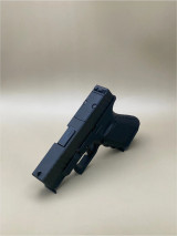 Side profile view of the Kineti-Tech Serrated Beveled Complete Slide mounted on a Glock® 26 Gen 3 frame in Armor Black CERAKOTE® finish. The image highlights the beveled edges, deep serrations, and durable finish designed for duty and defense applications.

Side view of Kineti-Tech Serrated Beveled Slide for Glock 26 Gen 3 in Armor Black CERAKOTE® finish.