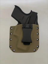 Black Glock 43/43X pistol inserted into a Flat Dark Earth Kydex holster with belt clip, demonstrating fit and retention.

Glock 43/43X in FDE Kydex holster with forward cant, fits most Glock slides for IWB or OWB carry.