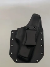 Black Kydex holster with belt clip attached and riveted edges, shown from the front on a neutral background.

Black Kydex holster for Glock 43/43X with adjustable cant, IWB/OWB compatible, made in USA.