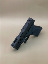 Kineti-Tech LWP Complete Slide for Glock® 43/43X in Armor Black CERAKOTE® finish. Showcases deep rear serrations, integrated lightening cuts for faster cycle rate, and optic-ready design for Shield® RMSc footprint optics.

Armor Black Kineti-Tech LWP Slide for Glock 43/43X with ported barrel and optic-ready design.