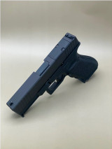 Side profile of the Kineti-Tech Serrated Beveled Slide for Glock® 17 Gen 5 showing its streamlined beveled design, aggressive serration layout, and durable Armor Black CERAKOTE® coating. Includes an RMR® footprint optic cut for red dot compatibility.

Side view Armor Black Serrated Beveled Kineti-Tech Slide for Glock 17 Gen 5 with RMR footprint.