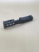 Image of the Armor Black CERAKOTE® Kineti-Tech LWP Slide for Glock® 43/43X with window cuts, deep rear serrations, and RMSc/Holosun K‑series optic compatibility for reduced recoil and faster target re‑acquisition.

Rear-angle view of the Armor Black Kineti-Tech Lightweight Ported slide for Glock with window cuts and RMSc/Holosun K optic cut.