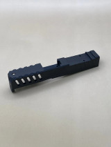 Side profile of the Kineti-Tech Velocity Slide in Armor Black CERAKOTE® finish. Features aggressive styling, integrated lightening cuts for faster cycle rate, and optic cut for RMSc-compatible optics.

Armor Black Kineti-Tech Velocity Slide for Glock 43/43X featuring front serrations and optic-ready design.