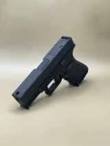 An angled front view of the Serrated Bullnose Slide showcasing the aggressive bullnose contour and deep-cut front serrations. The stainless steel barrel is partially visible, and the optic cut at the rear is highlighted. The image captures the slide’s tactical styling and robust build.

Angled front view of Glock 45 Gen 5 Serrated Bullnose Slide showing bullnose contour and optic cut.