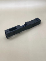 Side‑angled product image showing the Kineti‑Tech Ported Stripped slide highlighting its lightweight and performance‑driven design.

Side angled view of Kineti‑Tech Ported Black slide for Glock 19 Gen 5/19X with lightning cuts and RMR optic cut.