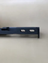 Closeup side view of the Kineti‑Tech Aero Glock® 45 Gen 5/19X stripped slide with elongated window port cuts and Armor Black Cerakote finish.

Kineti‑Tech Aero Glock 45 Gen 5/19X slide with side window cuts and black Cerakote finish.