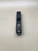 Top‑down image of the Kineti‑Tech Ported Stripped slide showing the large top port aligned above the 8‑port engineered for maximum gas expulsion and faster follow‑up shots.

Top view of Kineti‑Tech Ported Black Glock 45 Gen 5 Stripped slide showing top port and barrel ports.