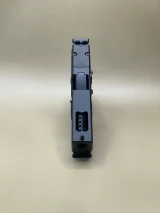 Top‑down image of the Kineti‑Tech Ported slide showing the large top port aligned above the 8‑port stainless steel barrel, engineered for maximum gas expulsion and faster follow‑up shots.

Top view of Kineti‑Tech Ported Black Glock 17 Gen 3 Ported slide showing top port and barrel ports.