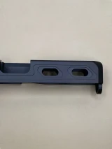 Closeup side view of the Kineti‑Tech Aero Glock® 19 Gen 3 stripped slide with elongated window port cuts and Armor Black Cerakote finish.

Kineti‑Tech Aero Glock 19 Gen 3 slide with side window cuts and black Cerakote finish.