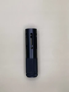 A black cylindrical barrel shroud tube shown upright against a light background. The body features elongated vertical slots and circular vent holes measuring 6 1/2 inches length arranged symmetrically around the tube. The lower portion has a textured knurled base, and the part is evenly lit to show surface finish and machining details.

Black cylindrical barrel shroud with vertical slots, circular vent holes, and a knurled base, shown upright on a light background.