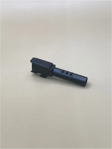 Angled view of a black 9mm ported pistol barrel on a light background, showing the top porting, smooth N3‑coated finish, and precision‑machined stainless steel construction.

Angled view of a Glock 43/43X Black Ported barrel with N3 coating on a light background.