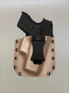 Black Glock 43/43X pistol inserted into a Rose Gold Kydex holster with belt clip, demonstrating fit and retention.

Glock 43/43X in Rose Gold Kydex holster with forward cant, fits most Glock slides for IWB or OWB carry.