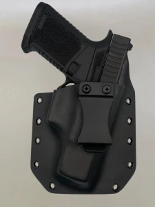 Black Glock 43/43X pistol inserted into a Flat Dark Earth Kydex holster with belt clip, demonstrating fit and retention.

Glock 43/43X in Black Kydex holster with forward cant, fits most Glock slides for IWB or OWB carry.