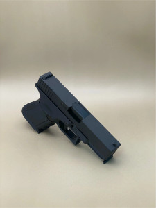 Angled view of the Kineti-Tech OEM Style Beveled Complete Slide for Glock® 19 Gen 3 in Armor Black CERAKOTE® finish. Features chamfered edges for a modern look, deep-cut front and rear serrations for superior grip, and optic-ready design for RMR® footprint optics.

Armor Black Kineti-Tech OEM Style Beveled Slide for Glock 19 Gen 3 with serrations and optic cut.