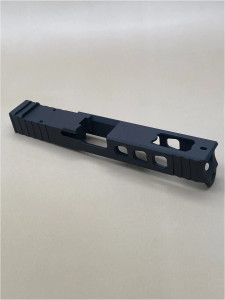 Angled view of the Kineti‑Tech LWP stripped slide for Glock® 17 Gen 3. Finished in Armor Black CERAKOTE®, this precision‑machined Glock slide features lightening window cuts for reduced slide weight, a large ported design, and an RMR optic cut designed for compatibility with micro red dot optics.

Black LWP stripped Slide for Glock 17 Gen 3 with lightening cuts, ported design, and RMR optic cut.